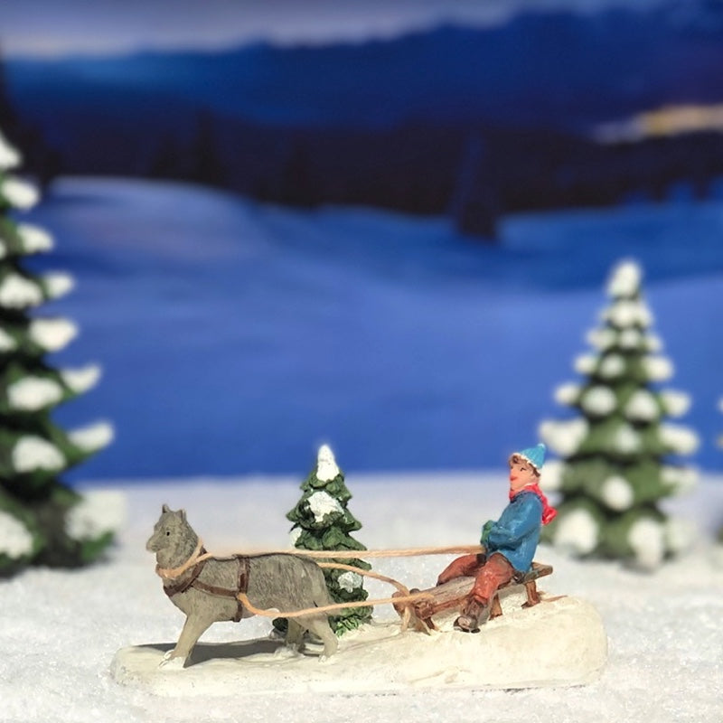 56381-A Child with dog sled