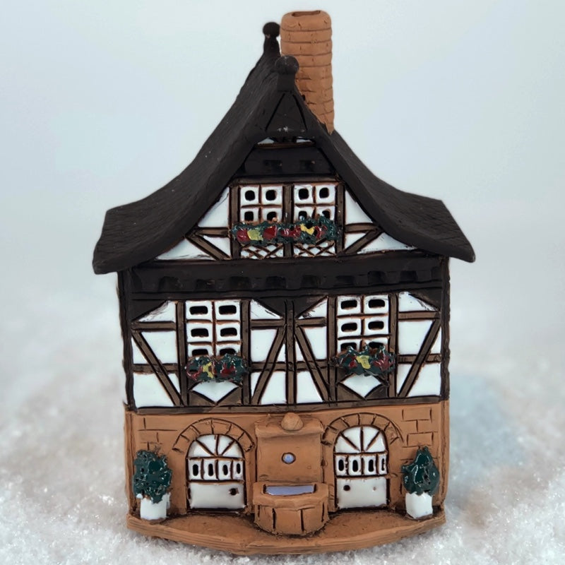 A002 Half-timbered house with well