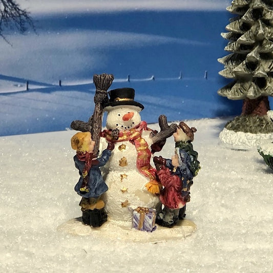 24272 Snowman with children