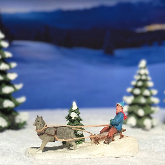 56381-A Child with dog sled